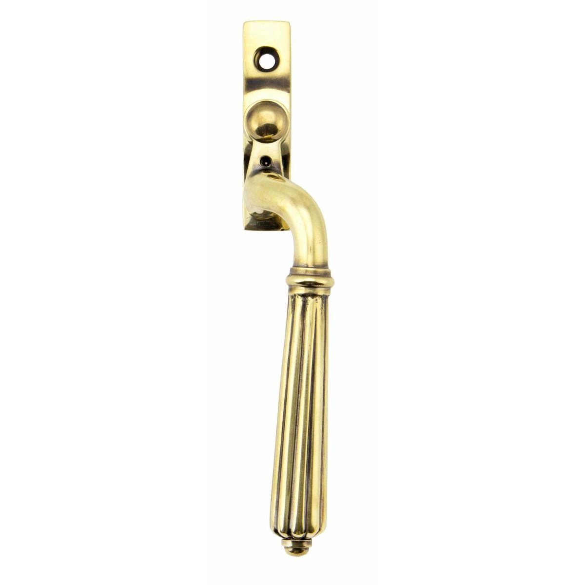 The Right Handed Aged Brass Reeded Georgian Espagnolette Window Handle on a White Background