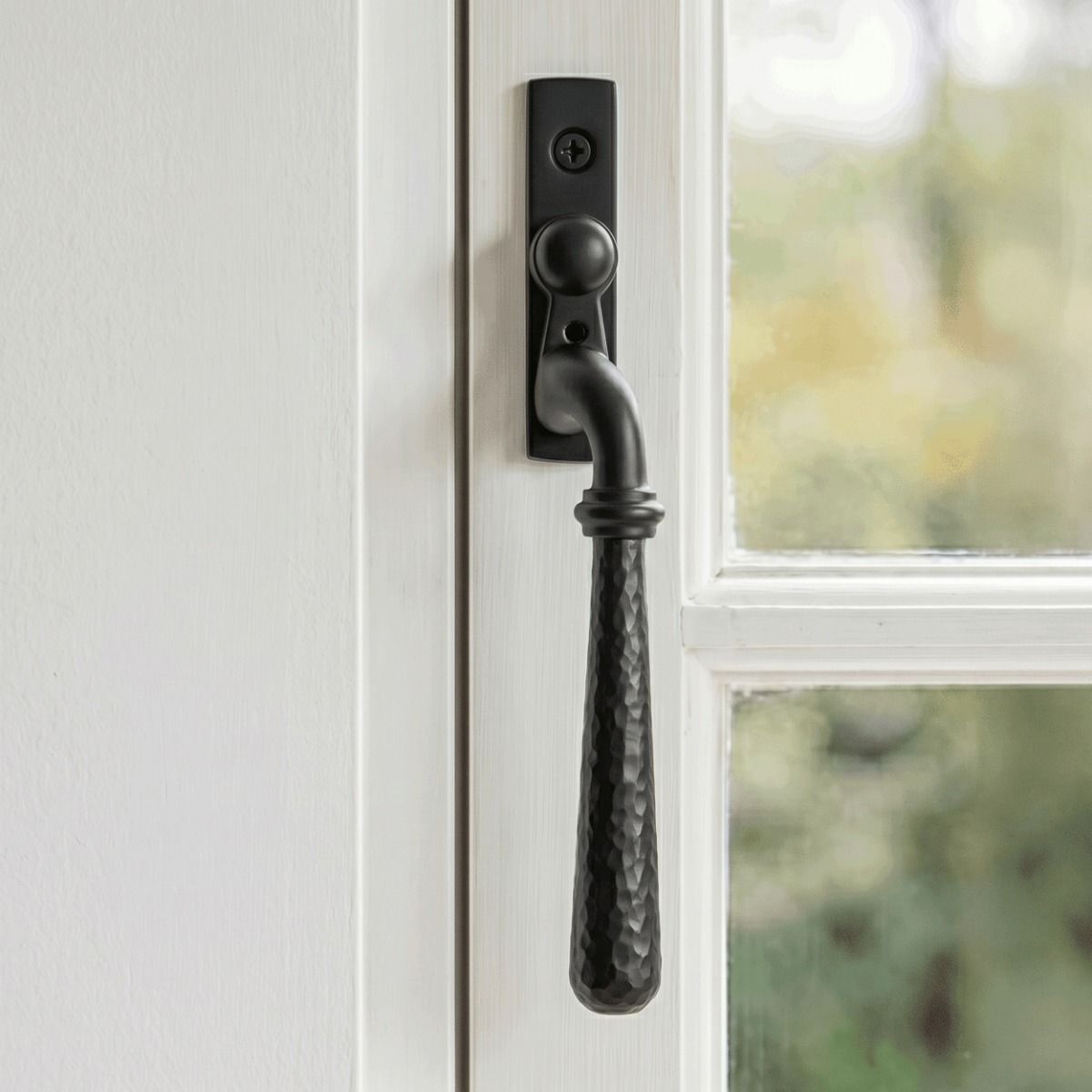 The Left Handed Dark Aged Bronze Hammered Espag Window Handle Mounted on a Traditional White Window Frame in a Country Home - Digital Illustration 