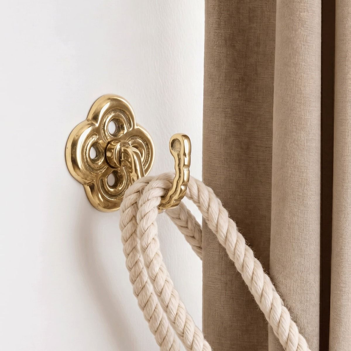 The “Riviera” Curtain tie back Fixed on a White Interior Wall Next to a Curtain - Digital Illustration