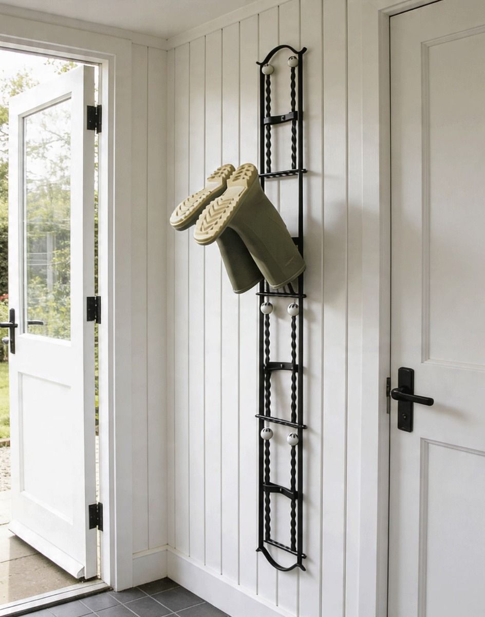 The Rotherfield Black 4 Pair Wall Mounted Boot Rack Mounted on an Interior Wooden Hallway wall - Digital Illustration 