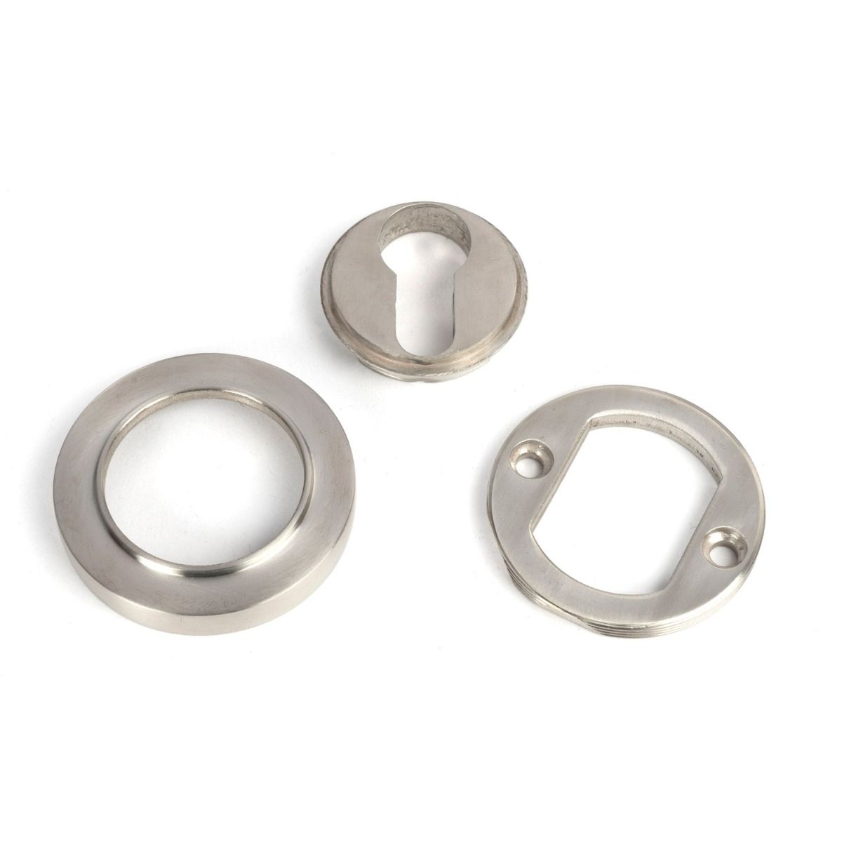 The Round Concealed Euro Keyhole Escutcheon in Satin Stainless Steel Shown with all Components on a White Background