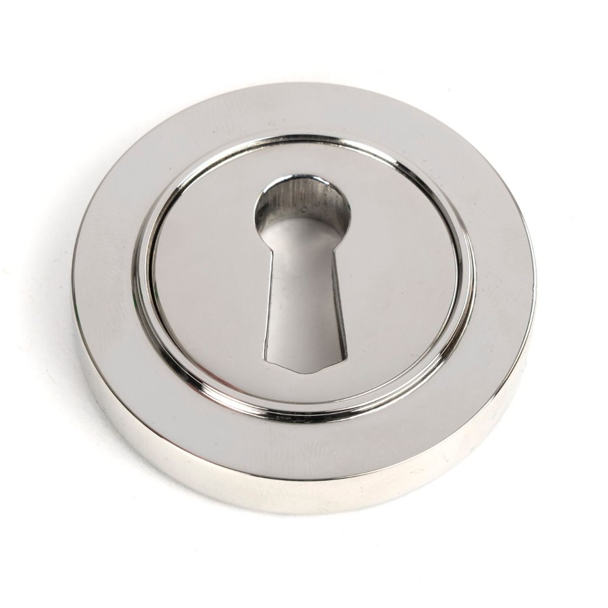 The Round Concealed Standard Keyhole Escutcheon in Polished Stainless Steel Shown on a White Background