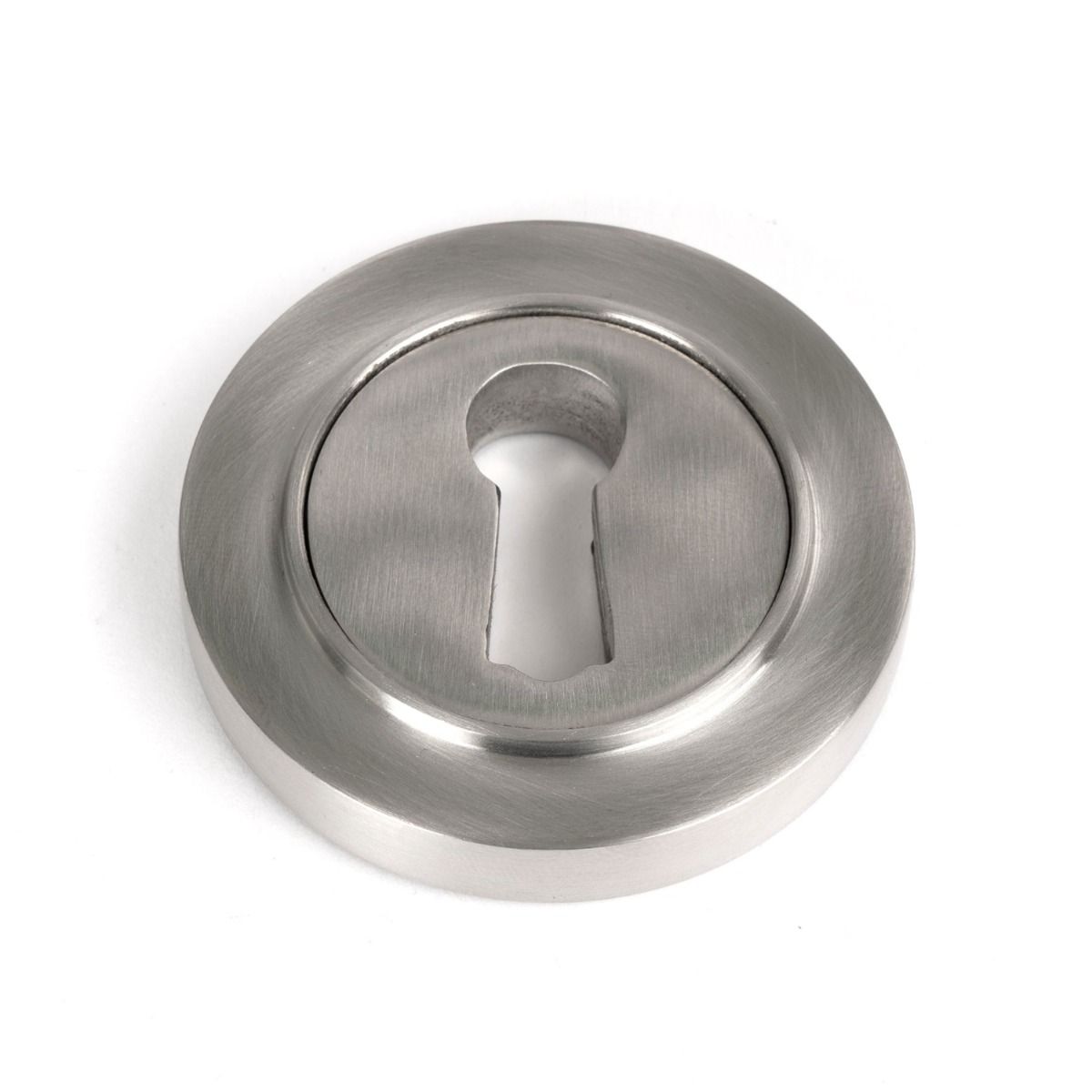 The Round Concealed Standard Keyhole Escutcheon in Satin Stainless Steel Shown on a White Background