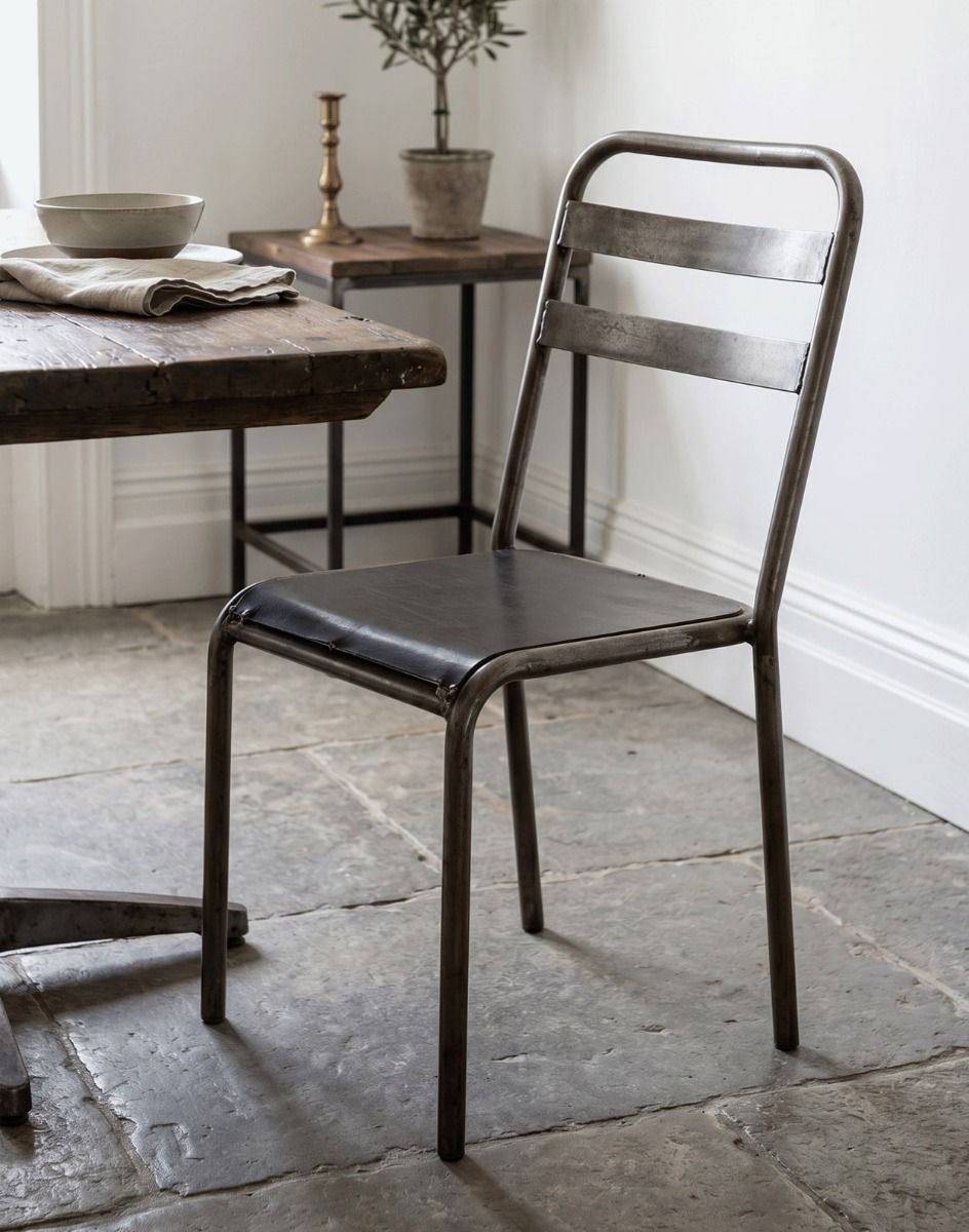 The Rustic Iron Vintage Chair next to a Dining Room Table - Digital Illustration
