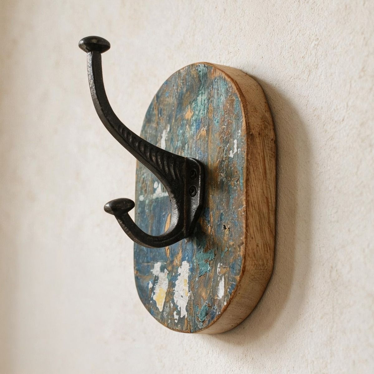 The Rustic Wood And Iron Coat Hook Shown Close Up Mounted on a Cream Coloured Interior Wall - Digital Illustration