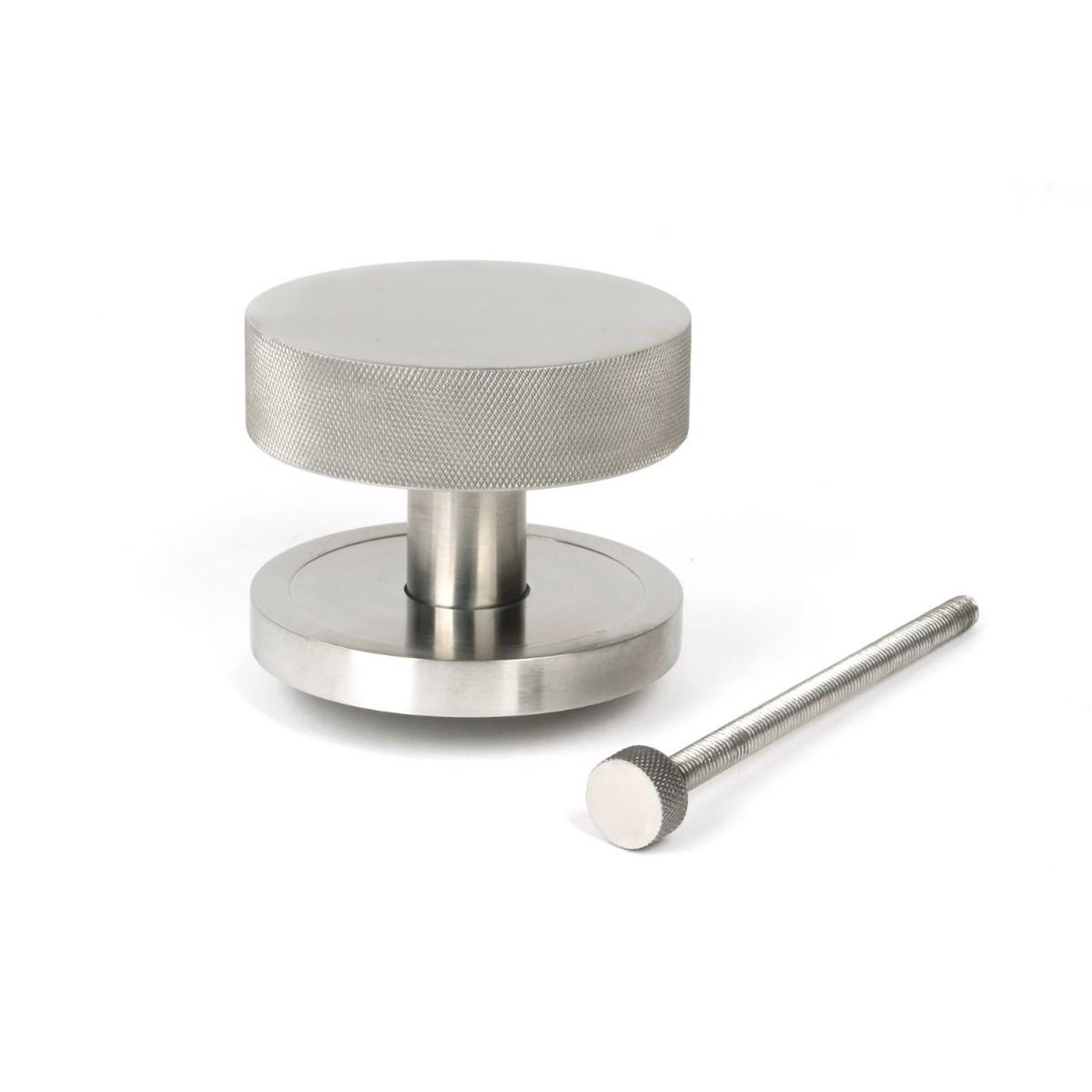 The Satin Stainless Steel Knurled Centre Door Knob on a Plain Rose with Bolt Fitting on a White Background 