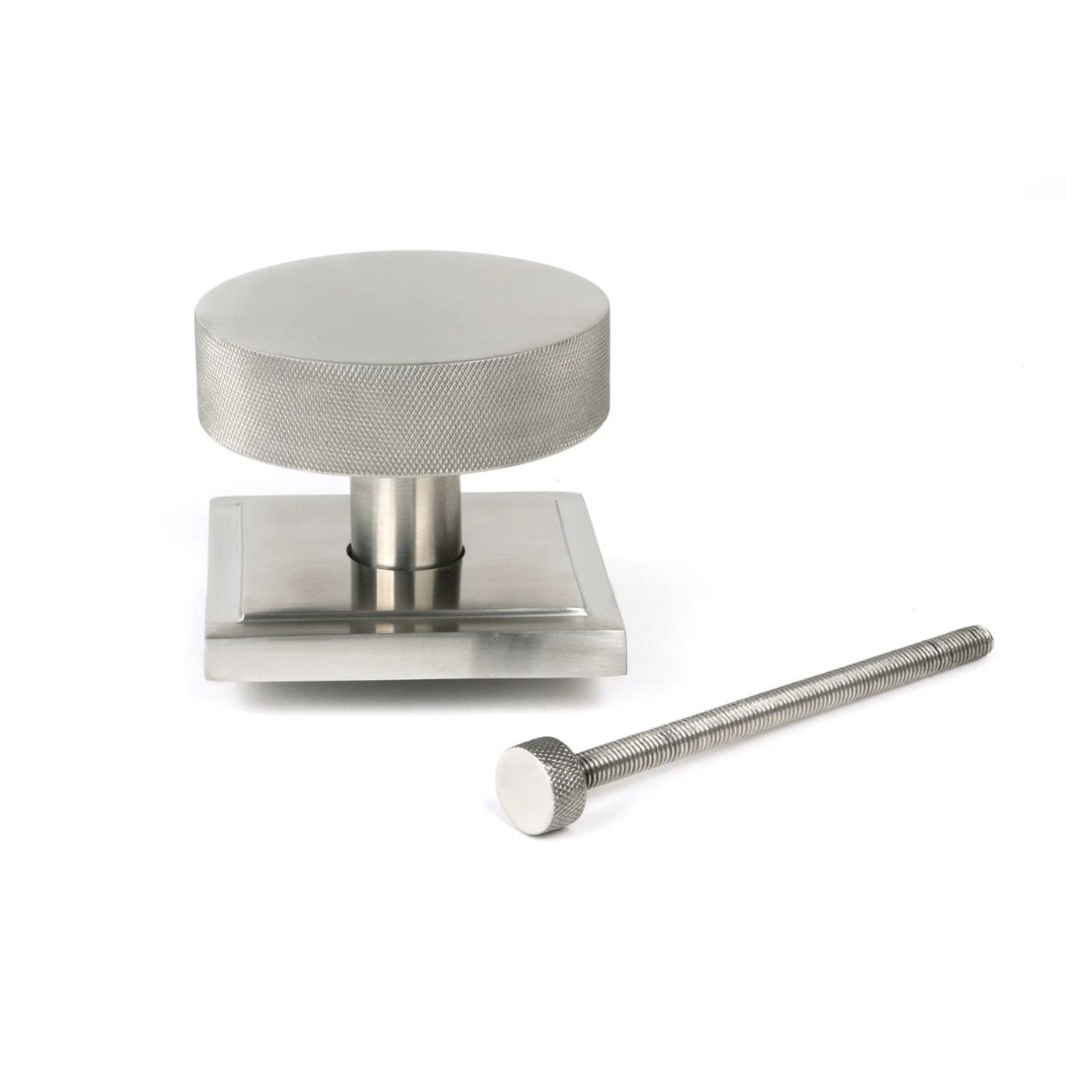 The Satin Stainless Steel Knurled Centre Door Knob on a Square Rose with Bolt Fitting on a White Background 