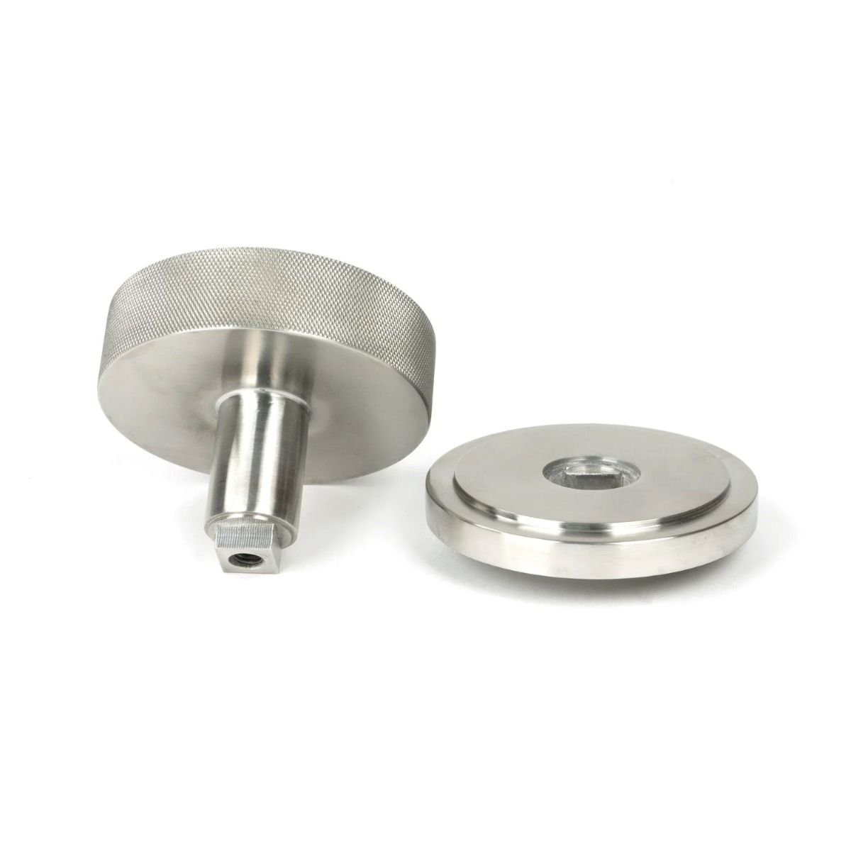 The Satin Stainless Steel Knurled Centre Door Knob on an Art Deco Rose on a White Background Displayed in Separate Sections. 