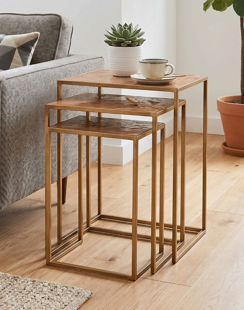 The Set of Three "Royal Copper" Metal Side Tables With a Cup of Coffee on top next to a Living Room Sofa - Digital Illustration