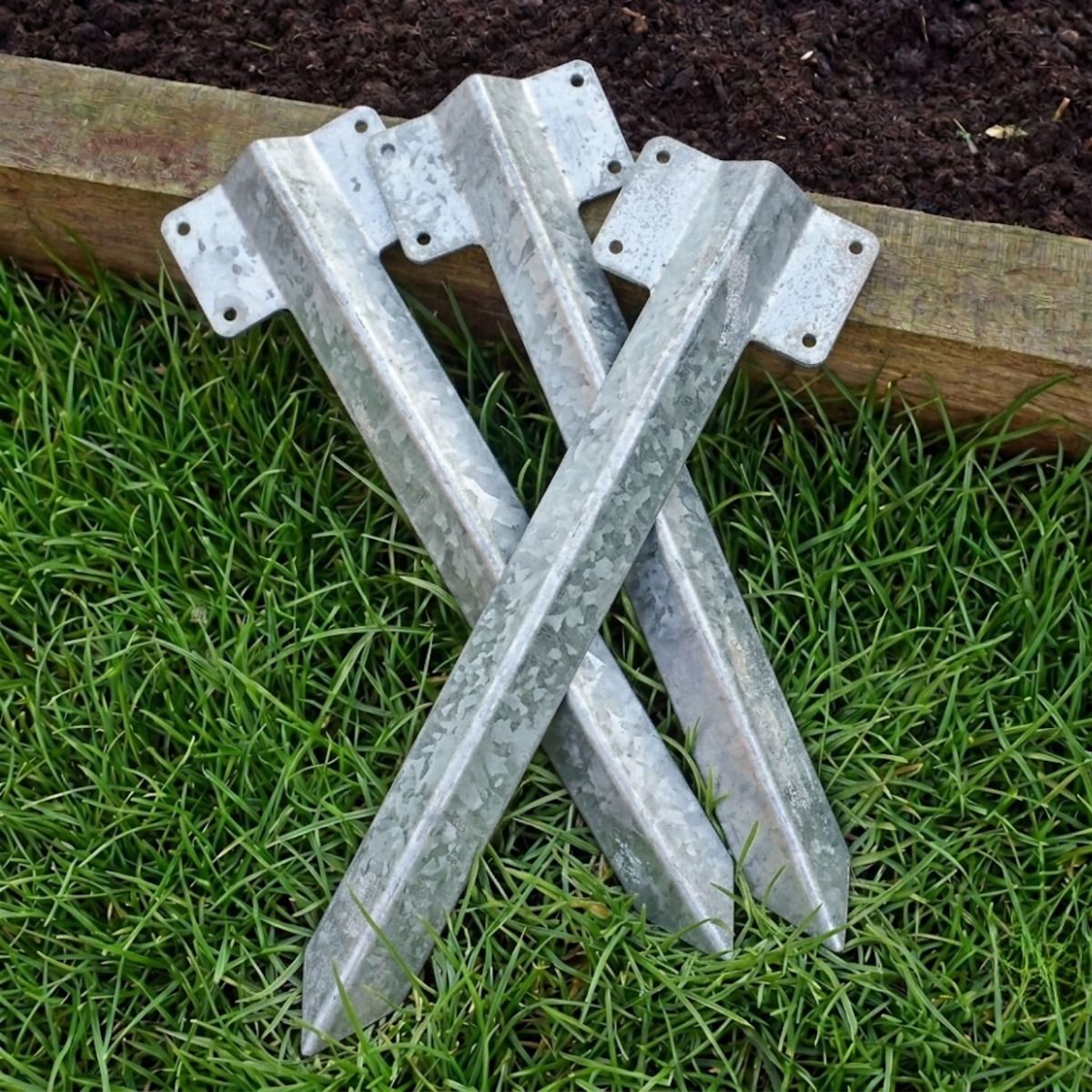 The Single galvanised Railway Sleeper Straight Inline Spikes in Brown next to a Raised Flower Bed
