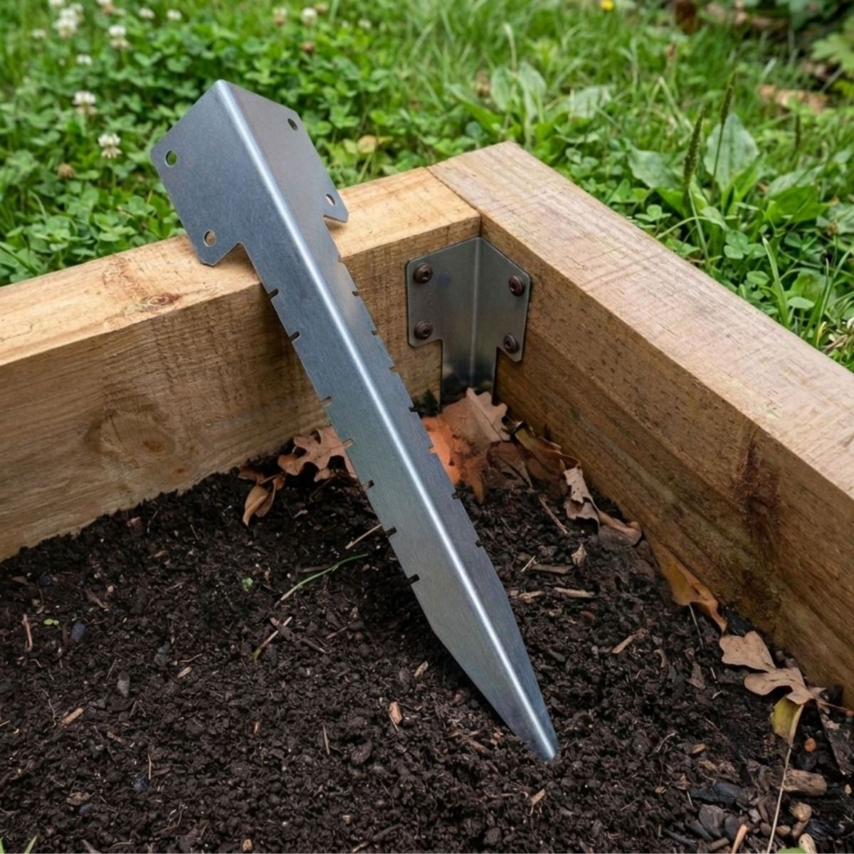 The Single Stainless Steel Railway Sleeper Corner Spike Laying on a Raised Flower Bed - Digital Illustration 