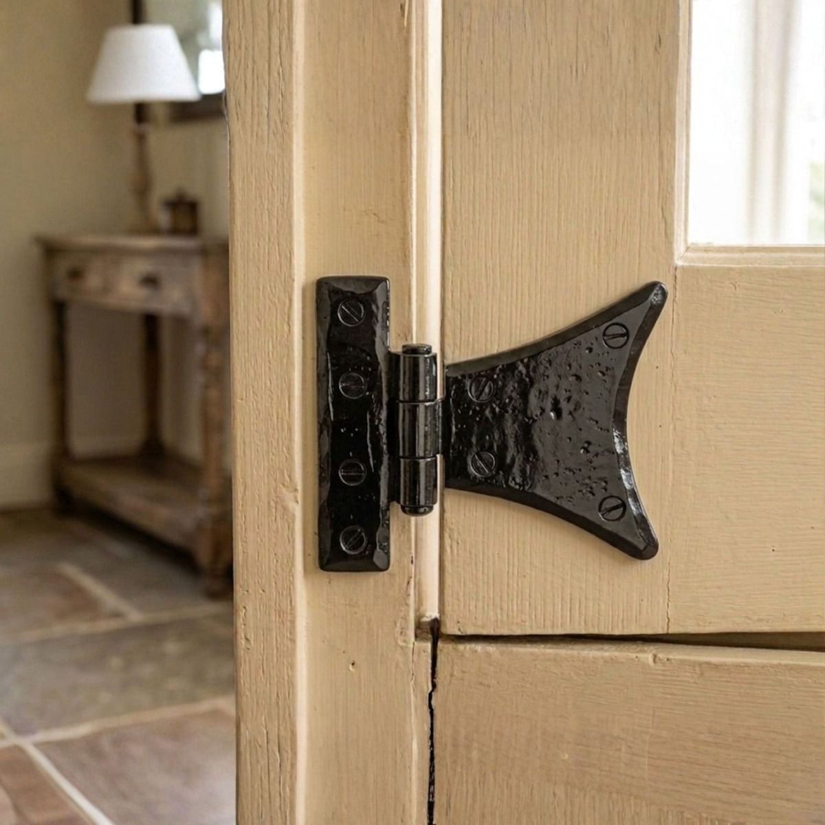 The Small Black Half Butterfly Hinge Pair on a Sectional Door in a Cottage home - Digital Illustration 