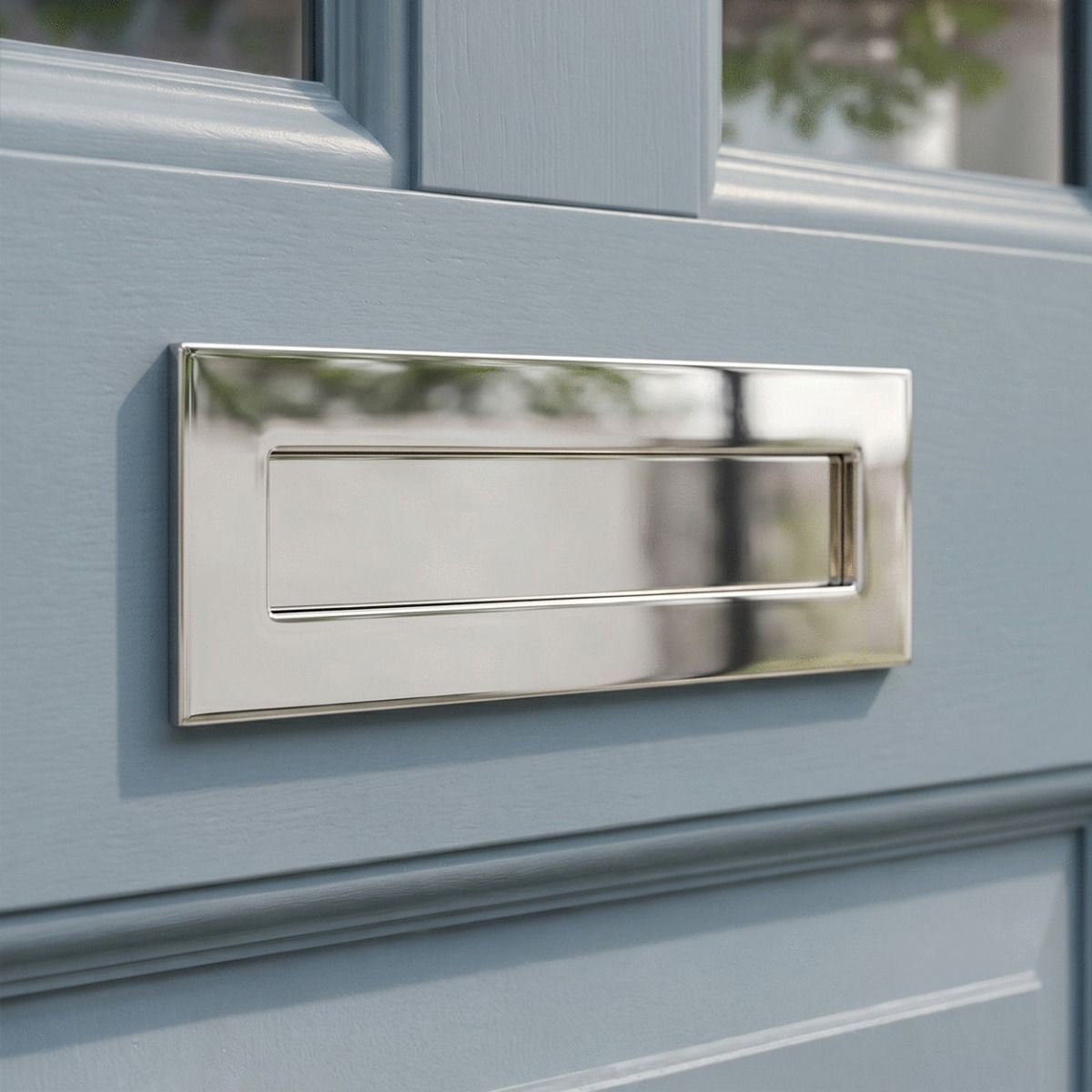 The Small Cast Brass Traditional Letter Plate in Polished Chrome on an Eggshell Blue Front Door - Digital Illustration 