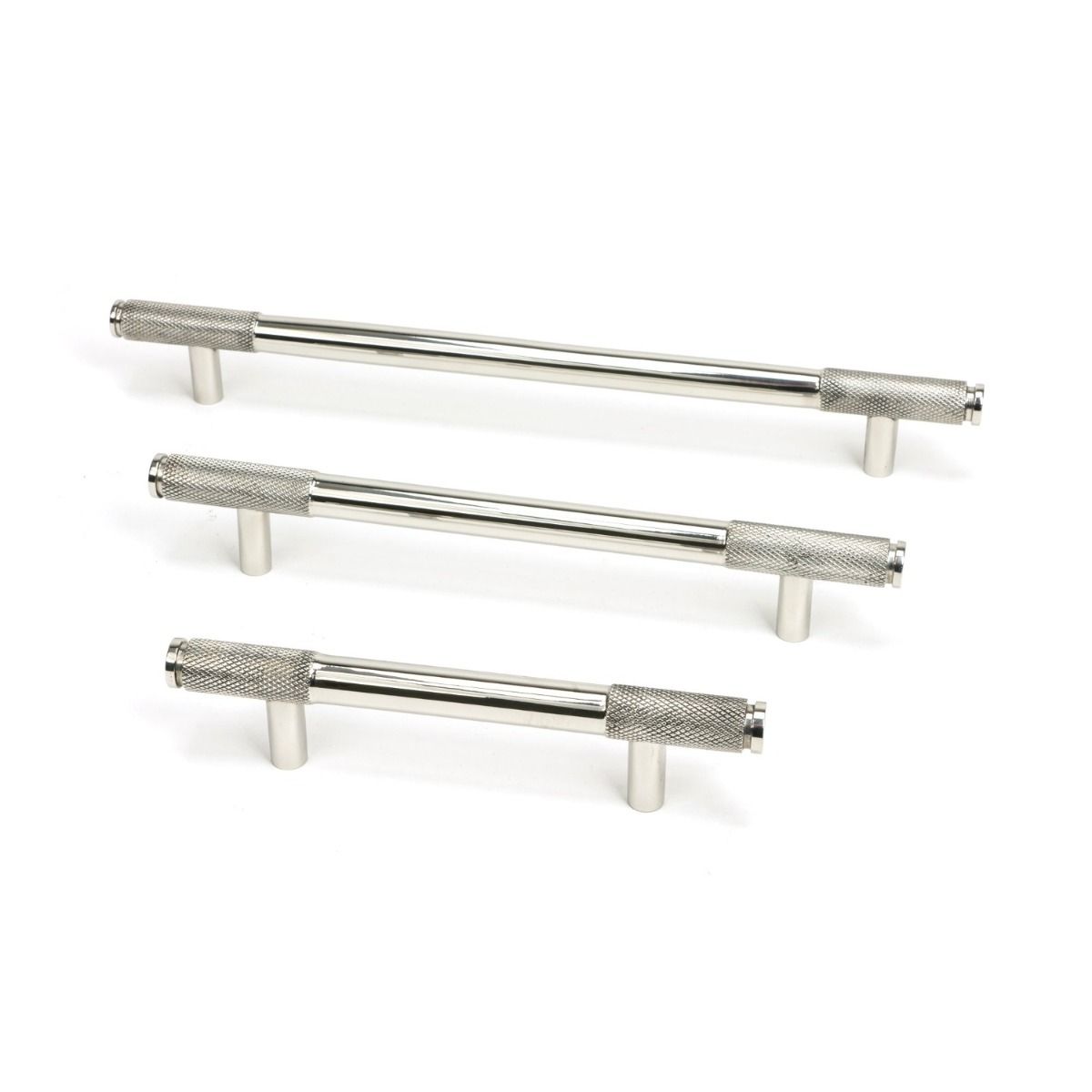 The Small Half Knurled Cabinet Pull Handle in Polished Stainless Steel Shown Alongside Other Sizes on a White Background