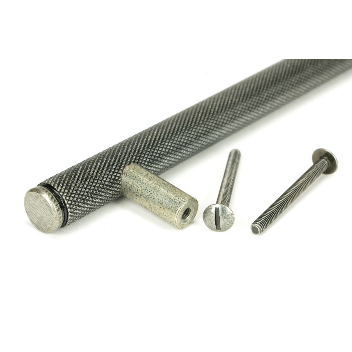 The Small Knurled Cabinet Pull Handle in Pewter Showing a Close up Image of the Supplied Fittings