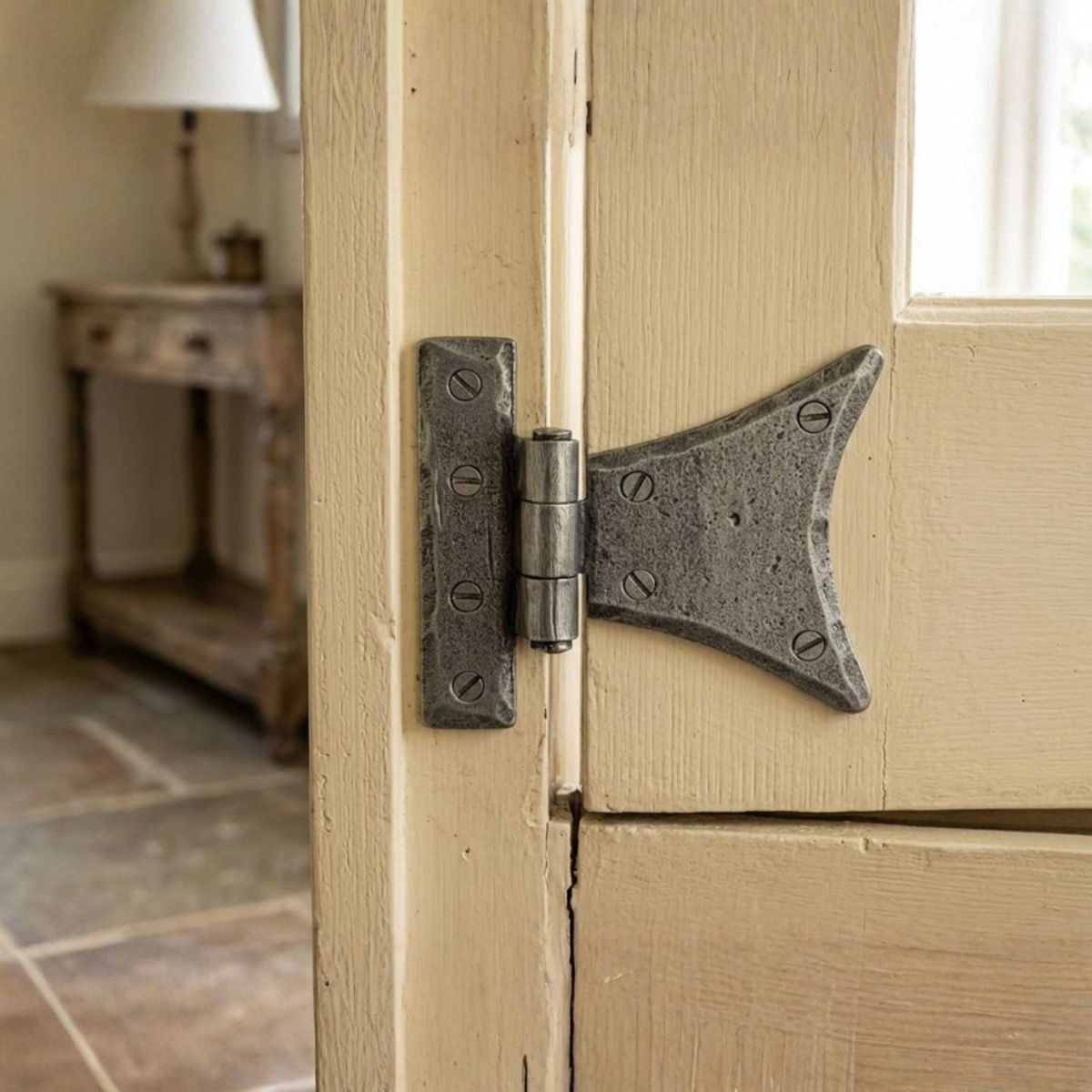 The Small Pewter Half Butterfly Hinge Pair on a Cream Cottage Door in a Country Home - Digital Illustration