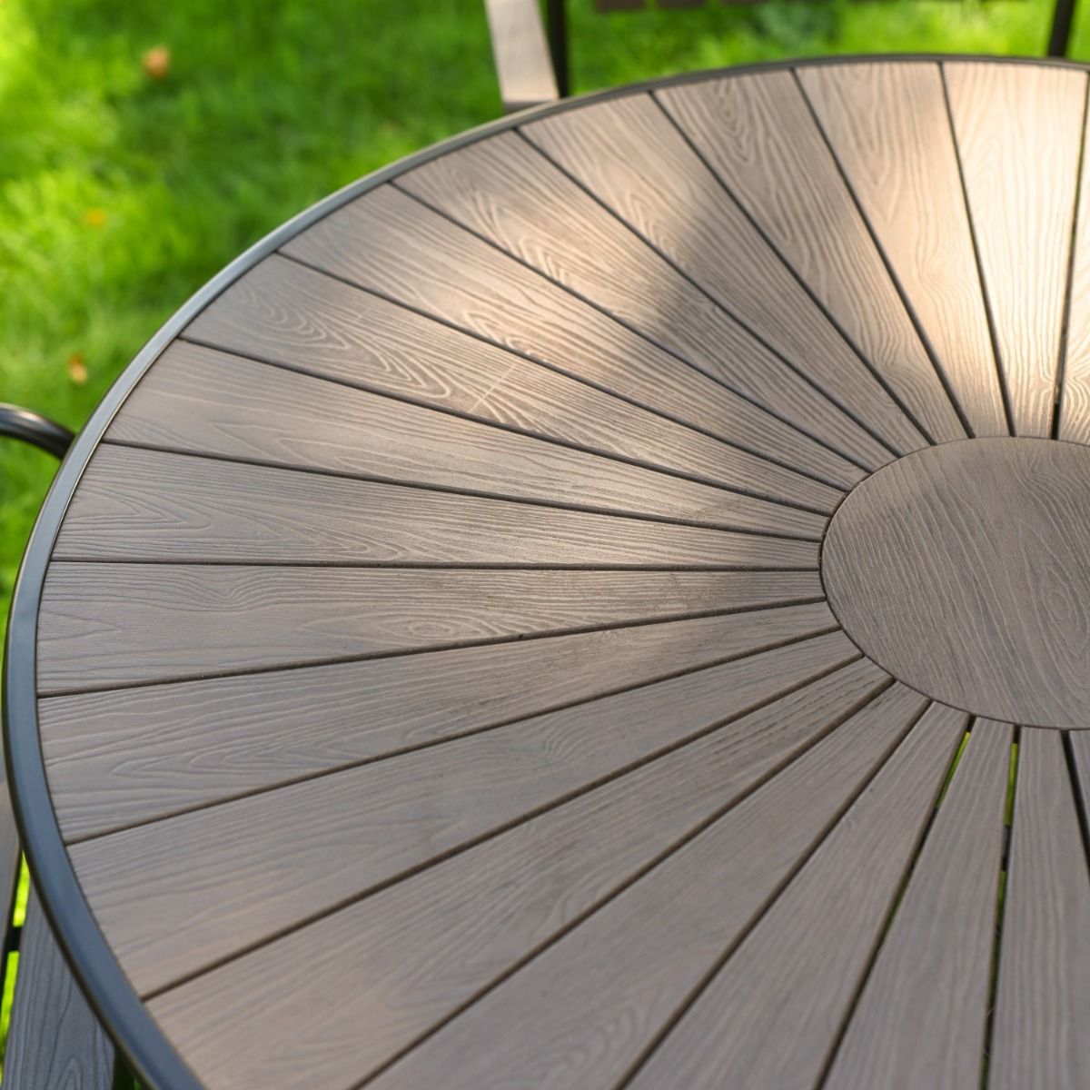 The Solis Round 4-Seater Outdoor Dining Set in Coffee Showing a Close up of the All Weather Table Top