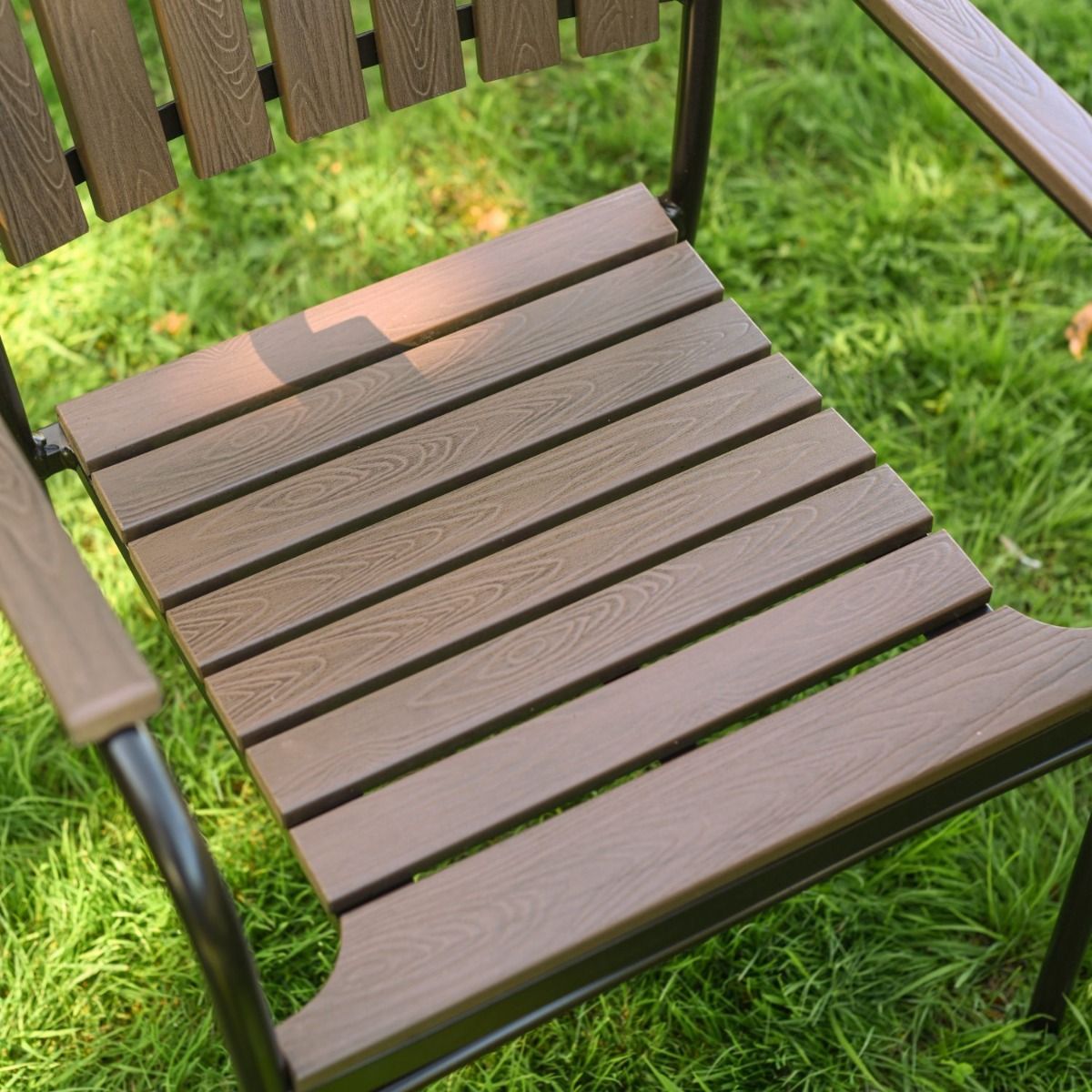 The Solis Round 4-Seater Outdoor Dining Set in Coffee Showing the Slatted Seat Design