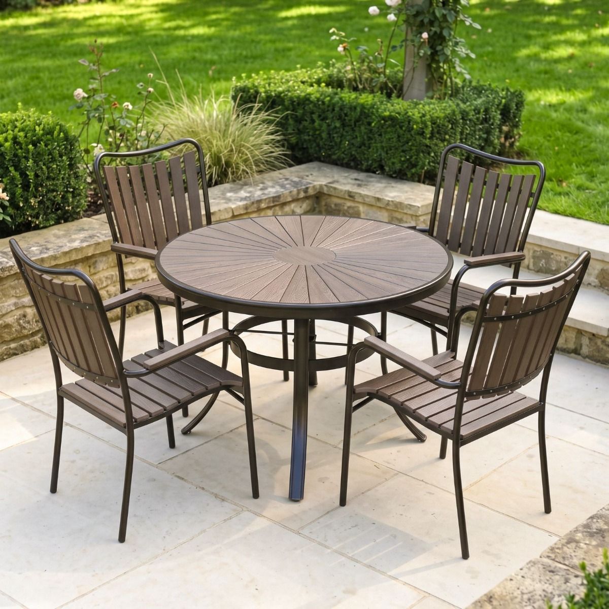 The Solis Round 4-Seater Outdoor Dining Set in Coffee Shown on a Sunny Patio in a Walled Garden