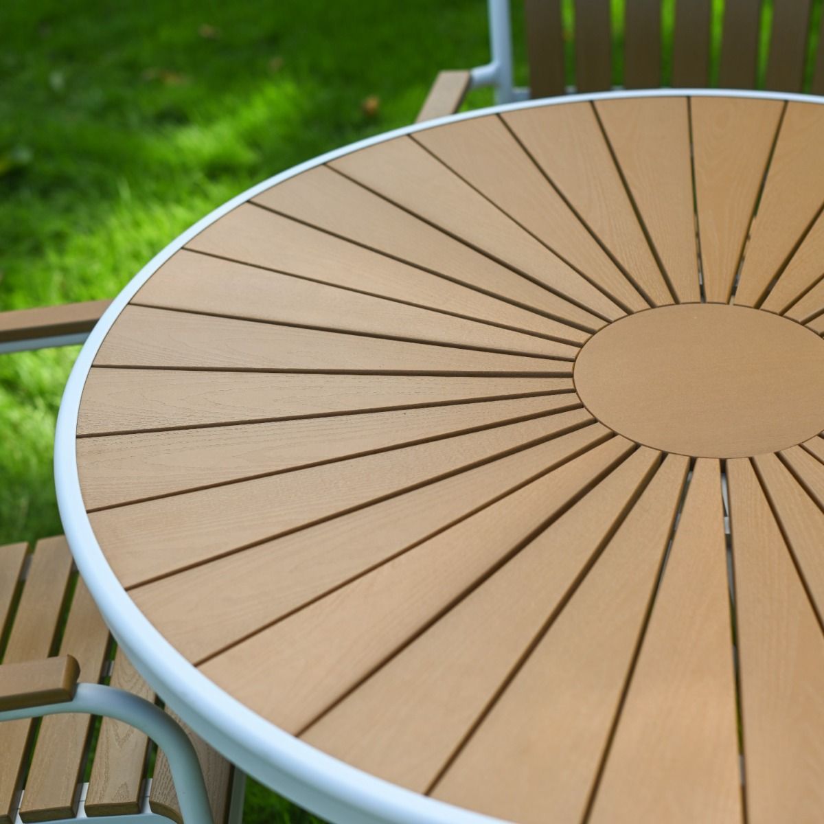 The Solis Round 4-Seater Outdoor Dining Set in White Showing the Arched Slatted Back Rest of a Chair