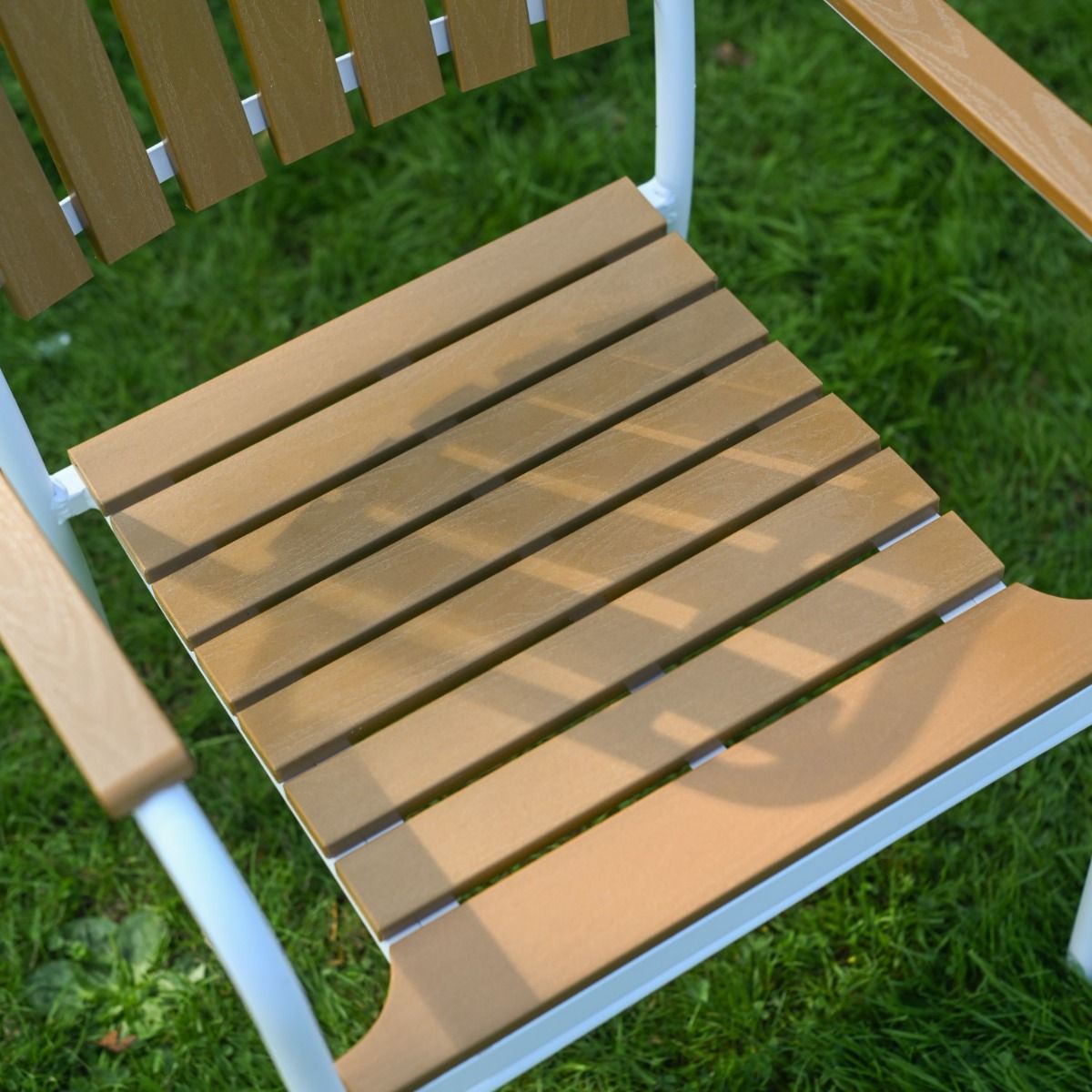 The Solis Round 4-Seater Outdoor Dining Set in White Showing the Slatted Seat on the Chair