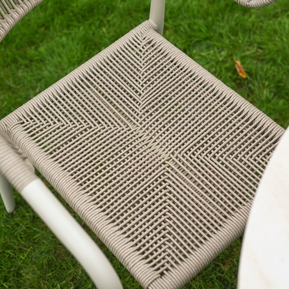 The Soria Woven 4-Seater Dining Set With a Close up of the Woven Seat