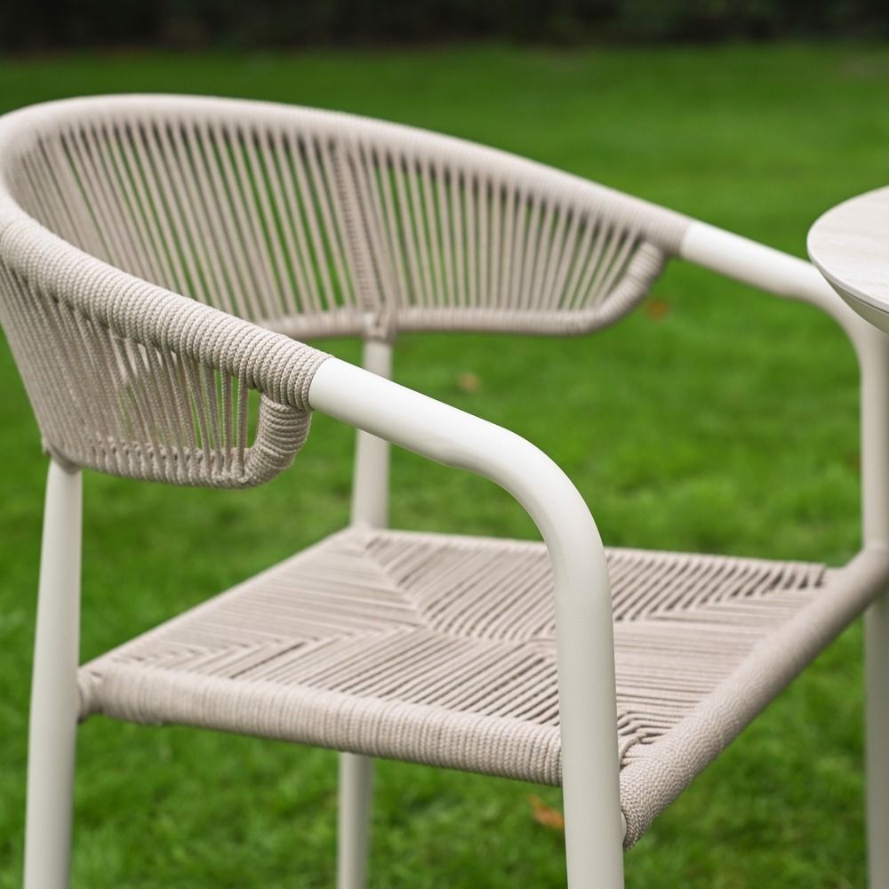 The Soria Woven 4-Seater Dining Set With a Side view of the Rope Weave Chair
