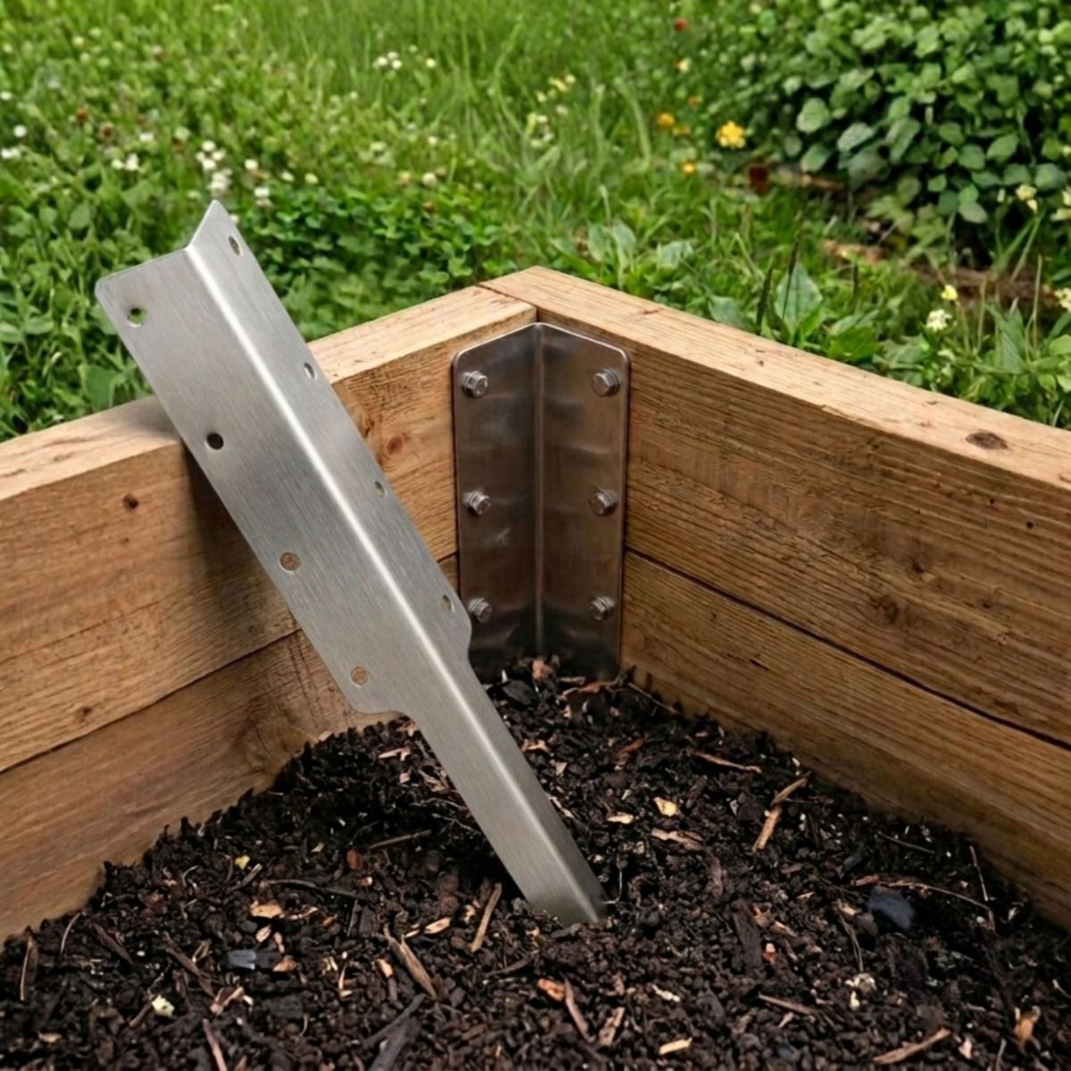 The Stainless Steel Railway Sleeper Corner Spike Shown Next to a Raised Garden Flower Bed - Digital Illustration