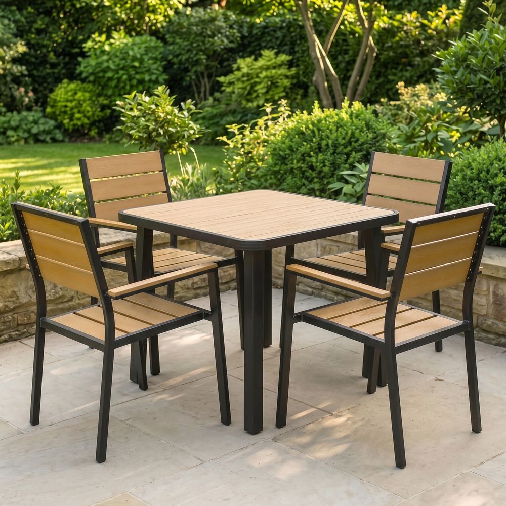 The Strata Slatted 4-Seater Outdoor Dining Set in Black Shown in a Sunny Low Walled Garden - Digital Illustration