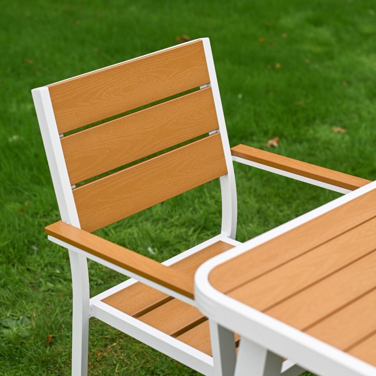 The Strata Slatted 4-Seater Outdoor Dining Set Showing a Detailed Close up of the Wood Effect Chair