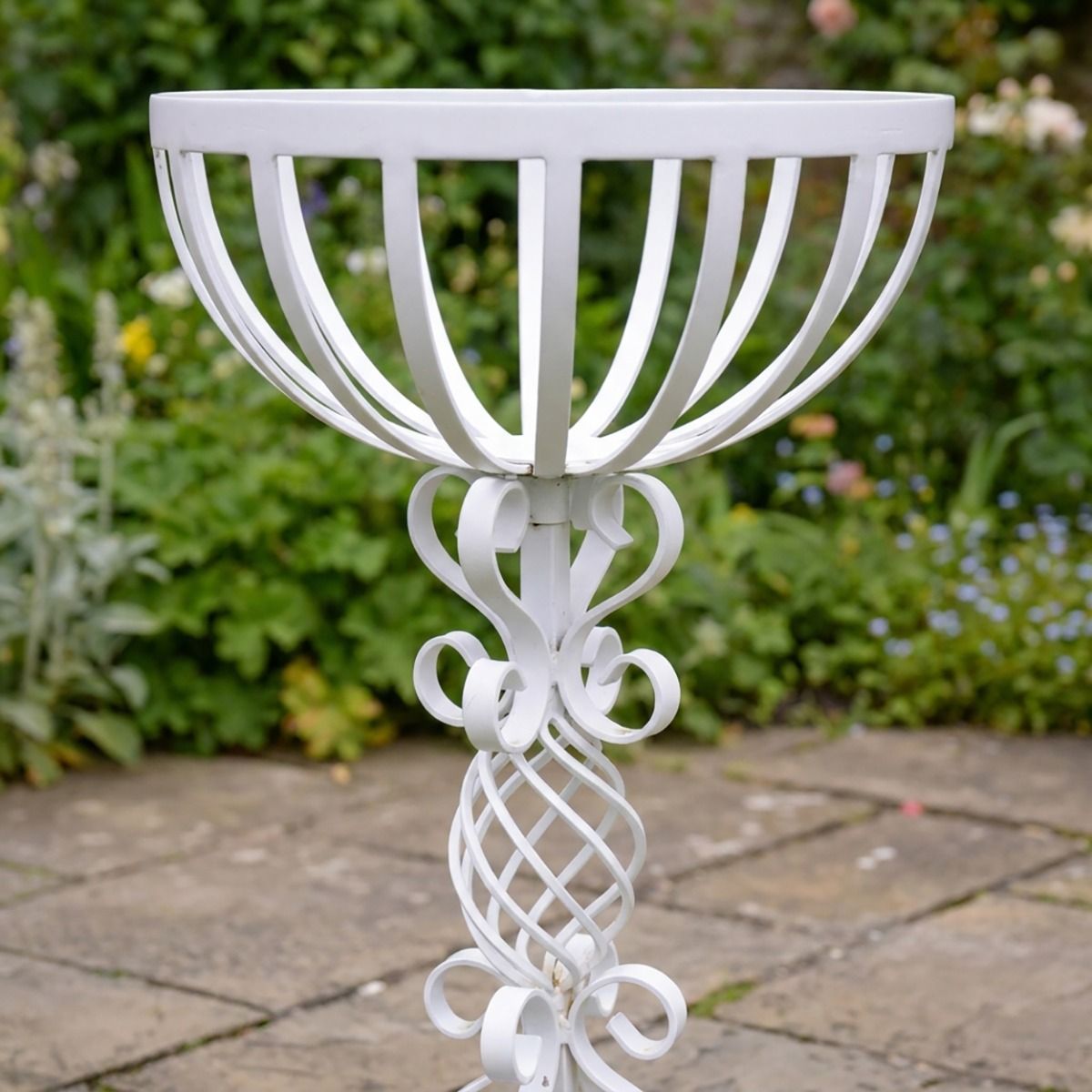 The "Stretton" Victorian Wrought Iron Basket Planter Stand in a White Finish Showing a Close up of the Detailed and Decorative Spiral Scrollwork on the Base - Digital Illustration 