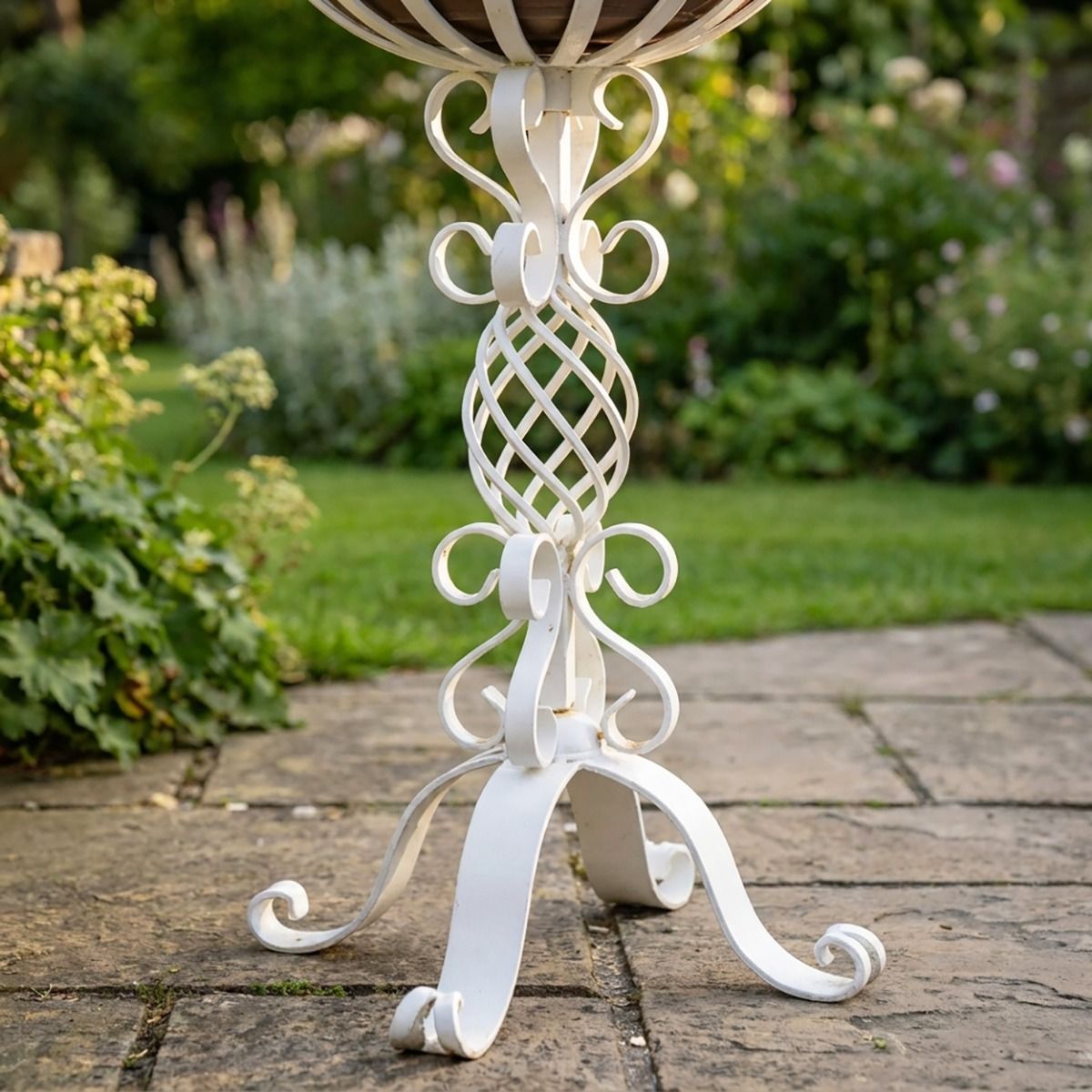 The "Stretton" Victorian Wrought Iron Basket Planter Stand in a White Finish Displaying the Decorative Scroll Work Base - Digital Illustration 