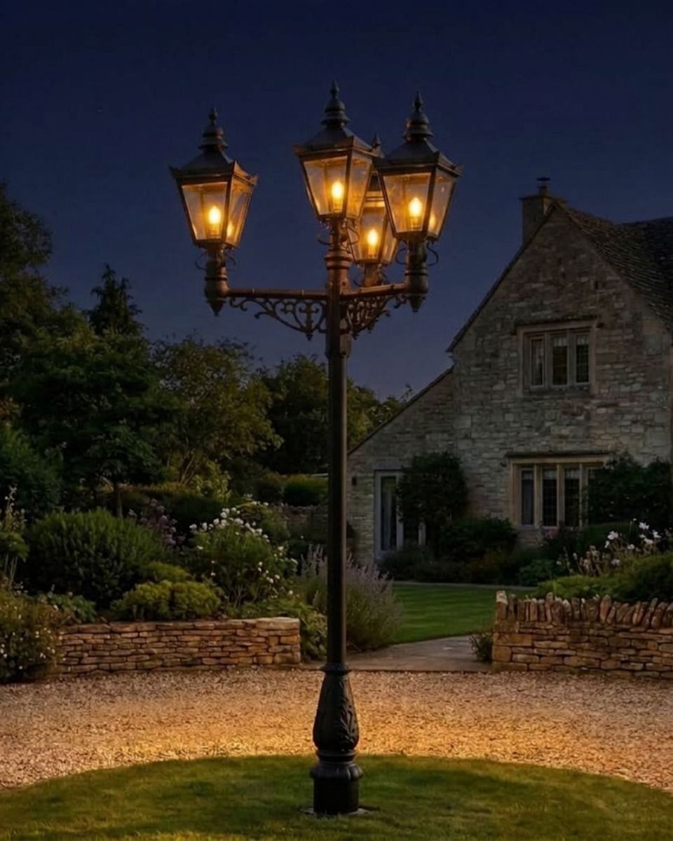 The Victorian Quadruple Lamp Post and Lantern Set Shown Lit up at Night in Front of a Grand Home - Digital Illustration 