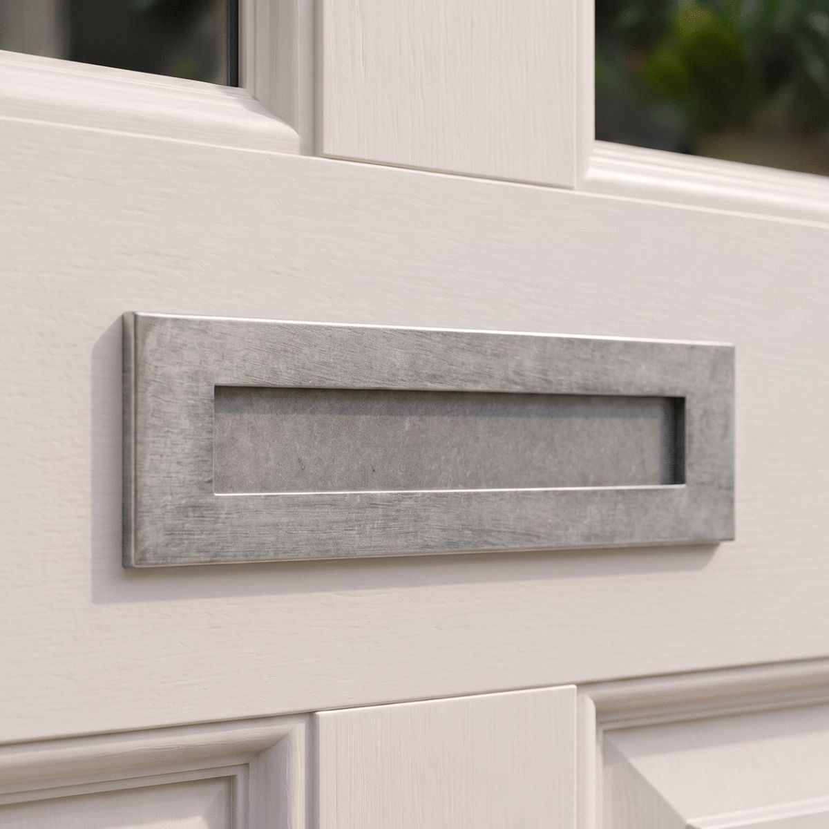 The Traditional 12 Inch Front Door Letter Plate with Antique Period Style Flap in a Pewter Finish on a Front Door on a Period Property - Digital Illustration 