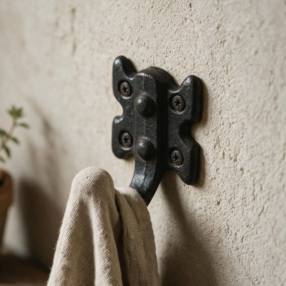 The Traditional Black Iron Coat and Hat Hook With Butterfly Backplate Used to Hang a Scarf in a Entrance Hallway - Digital Illustration