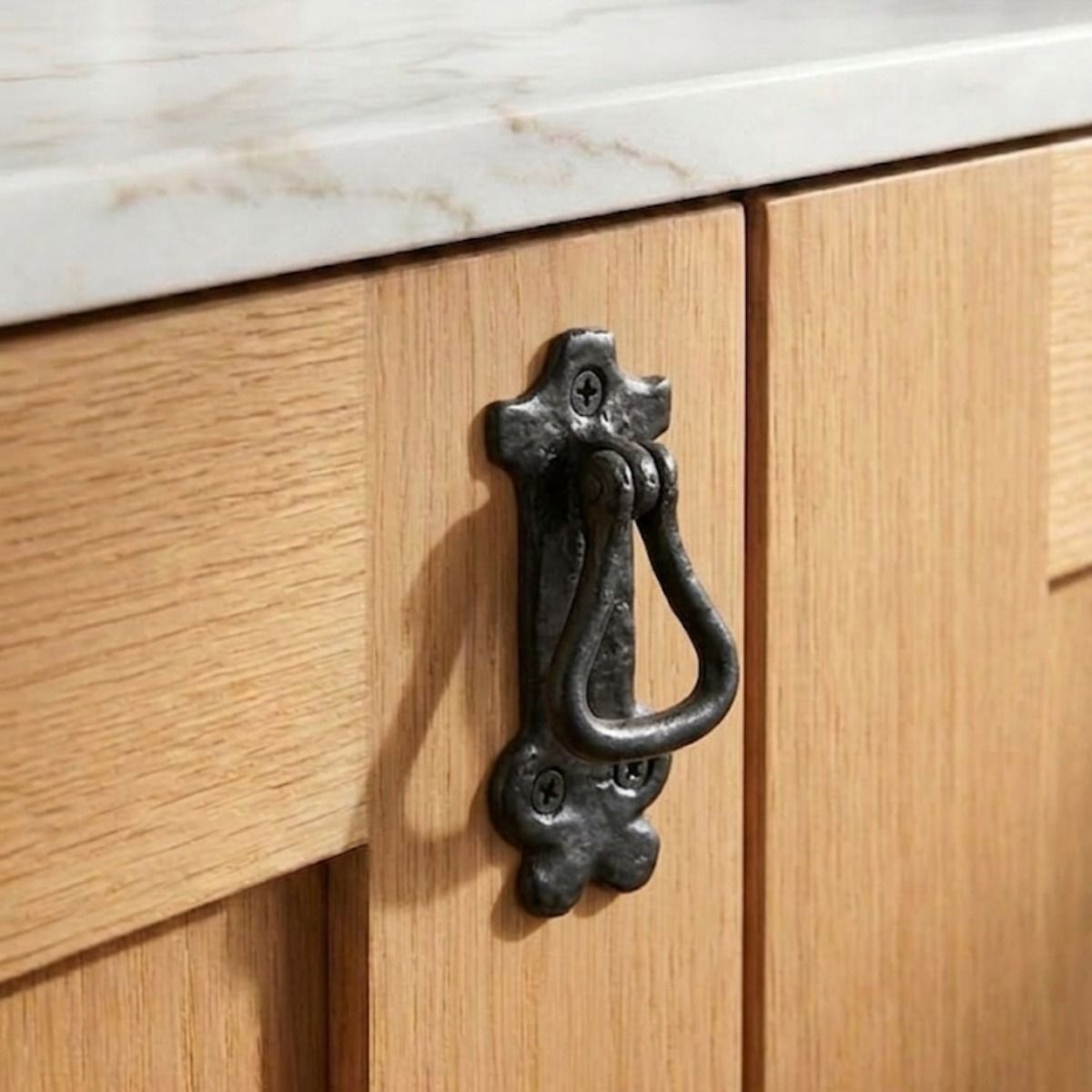 The Traditional Black Iron Drop Cabinet Looped Pull Handle Mounted on a Contemporary Wooden Kitchen Cabinet - Digital Illustration 