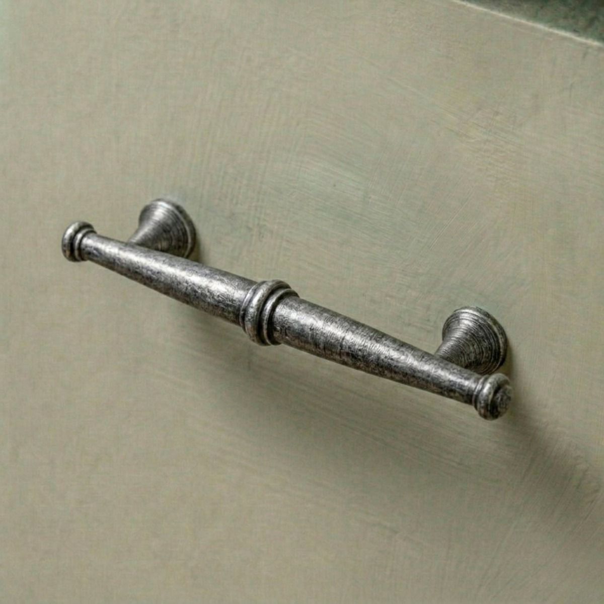 The Traditional Pewter Pull Handle Mounted on a Green Contemporary Kitchen Drawer - Digital Illustration 