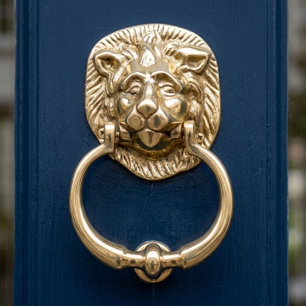 The Traditional Polished Brass Lion Door Knocker on a Blue Front Door Shown Close up - Digital Illustration 