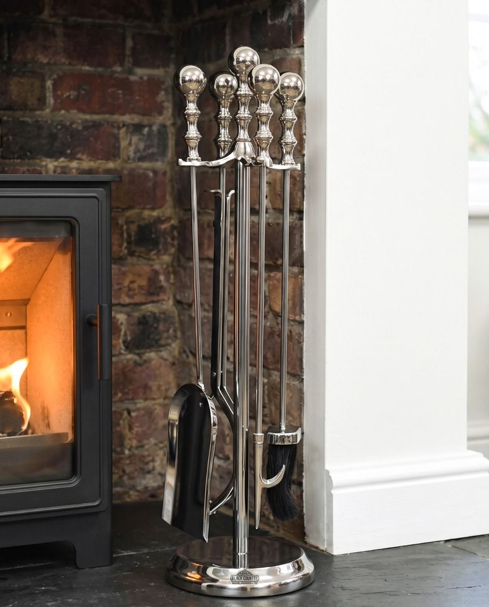 The Traditional Polished Steel Four Tool Companion Set 64cm with a Wood Burner Stove Behind - Digital illustration 