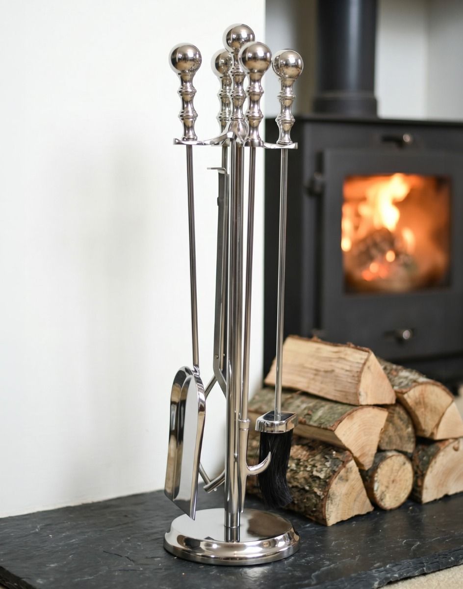 The Traditional Polished Steel Four Tool Companion Set next to Some Dried Logs for a Log Burner Stove in a Country Home - Digital Illustration