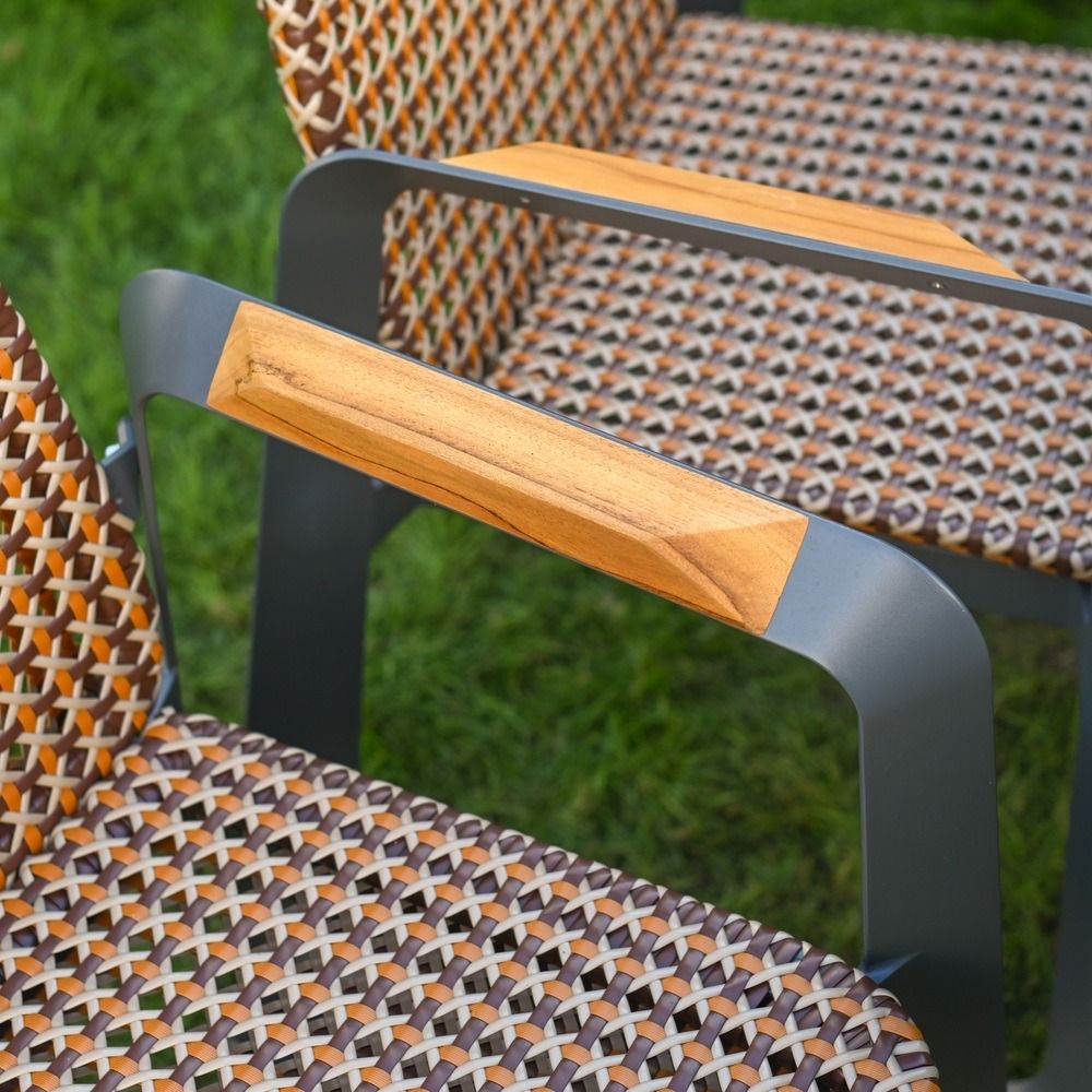 The Tribeca Weave 8-Piece Patio Dining Set Showing a Close up of the Wood Effect Chair Armrest