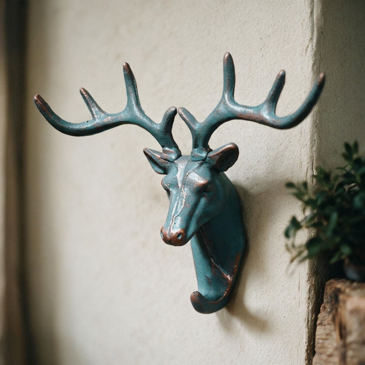 The Verdigris Stag Hook Mounted on a Cream Wall in a Well Lit Interior - Digital Illustration 