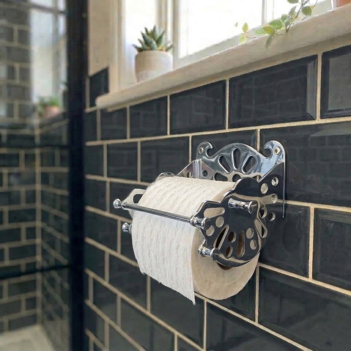 Digital Illustration of the Chrome Version of The Victorian ”Mitchell” Toilet Roll Dispenser Holding a Toilet Roll from an Angled View