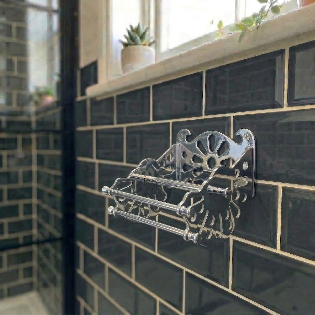 Digital Illustration of the Chrome Version of The Victorian ”Mitchell” Toilet Roll Dispenser Without a Toilet Roll from an Angled View