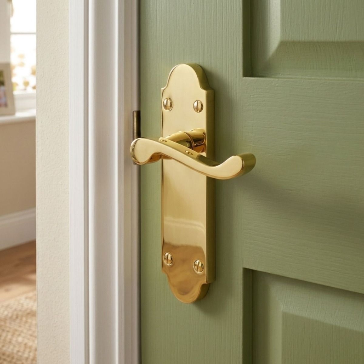 The Victorian Scroll Latch Arched Door Handle in Polished Brass on a Green Painted Door in a Luxury Home - Digital Illustration