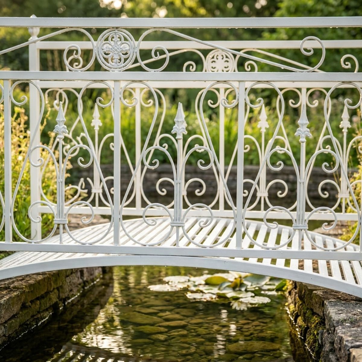 The Westminster Victorian Ornate Wrought Iron Garden Bridge in a White Finish Shown in a Sunny Private Garden over a Small Stream Focussing on the Central Scroll Work - Digital Illustration 