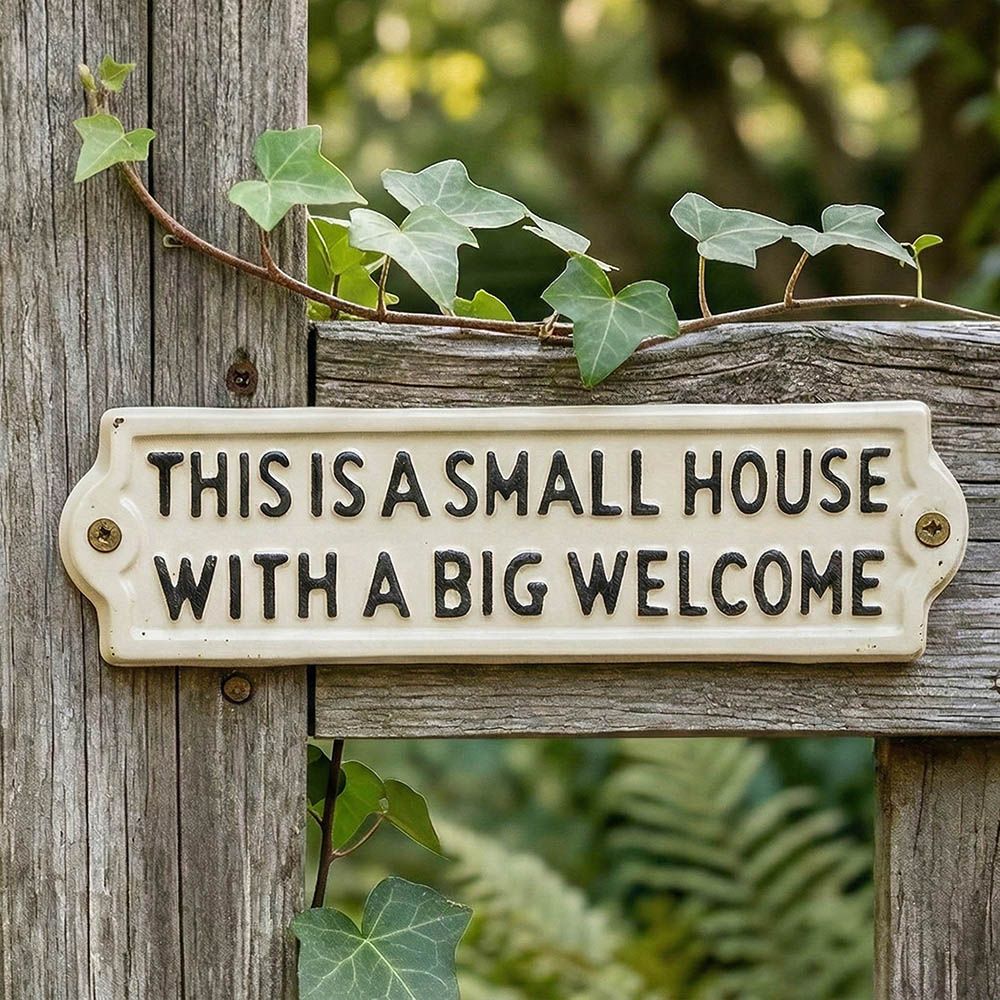 Close Up Of The This is a small house with a big welcome Cast Iron Sign Digital Illustration
