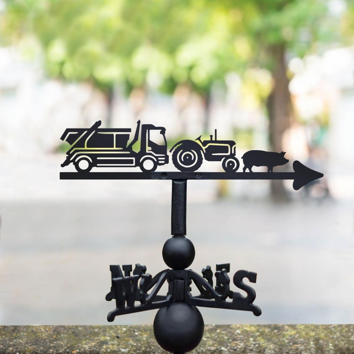 Tractor, Skip, Lorry & Pig Weathervane in a park
