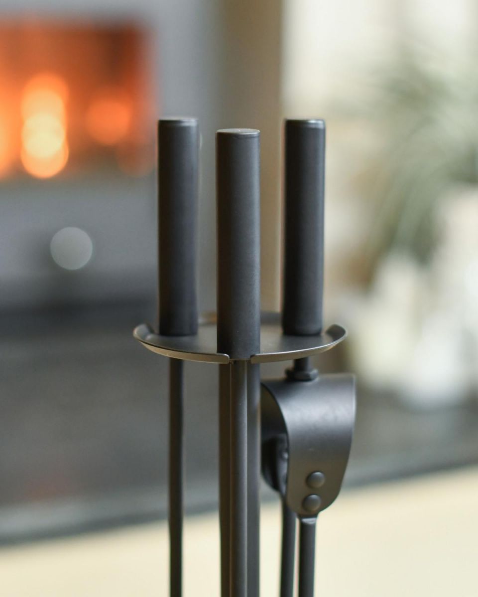 Close Up Of Traditional Black Slim Three Piece Companion Set Handles