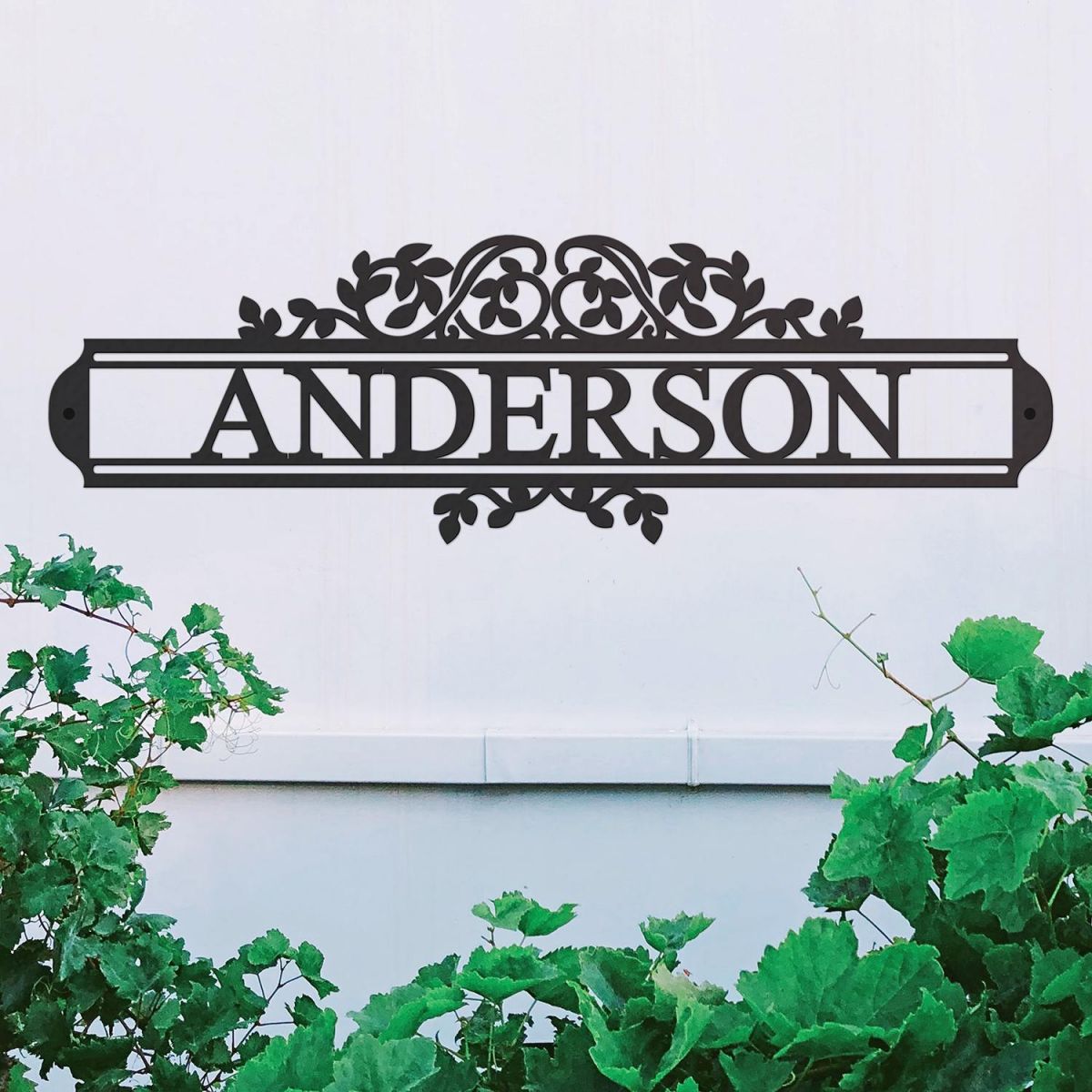 Traditional Foliage House Name Sign in Situ on a White Wall